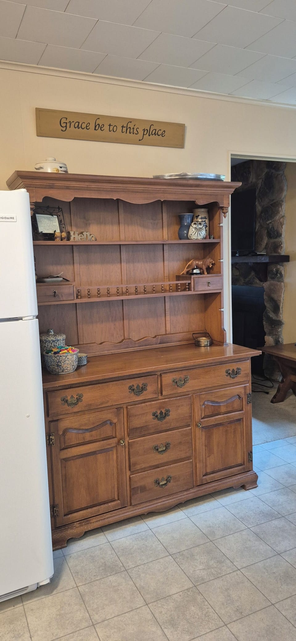 Hutch in kitchen. Provides a place to set a few of guests items. 