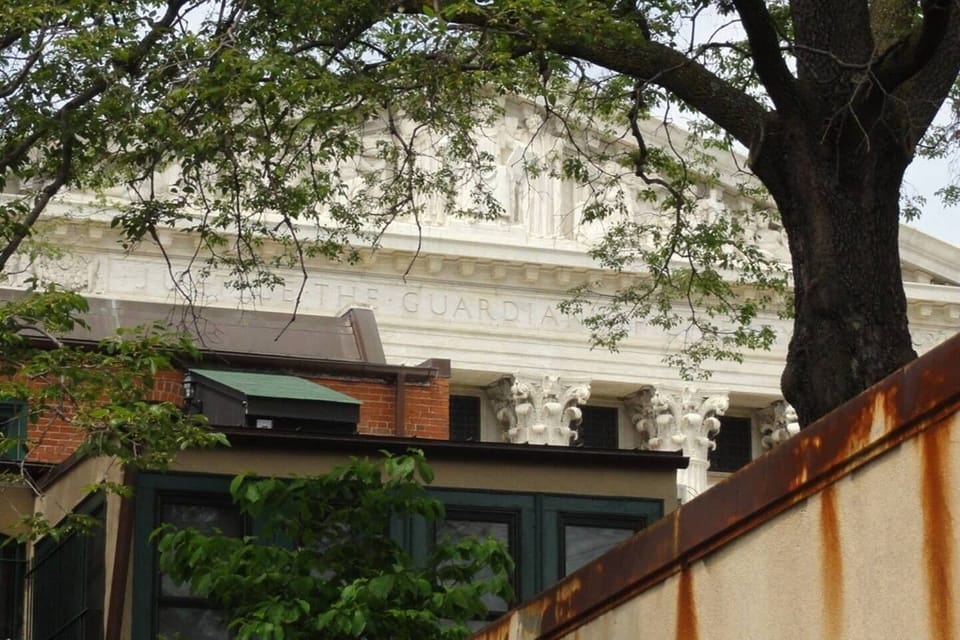 Peeks at Supreme Court from backyard