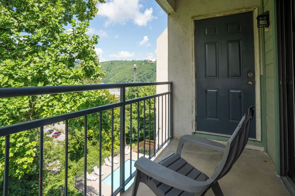 Step onto your private balcony and breathe in the fresh mountain air. Lush greenery frames stunning hillside views, offering a peaceful retreat where you can relax and unwind above it all.