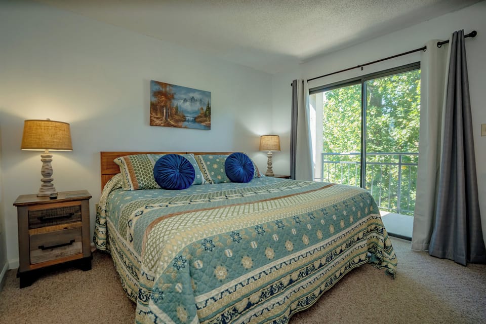 Wake up refreshed in your cozy bedroom, where soothing coastal tones and plush bedding invite you to unwind. Natural light filters through the windows, framing lush green views and welcoming your peaceful mornings.
