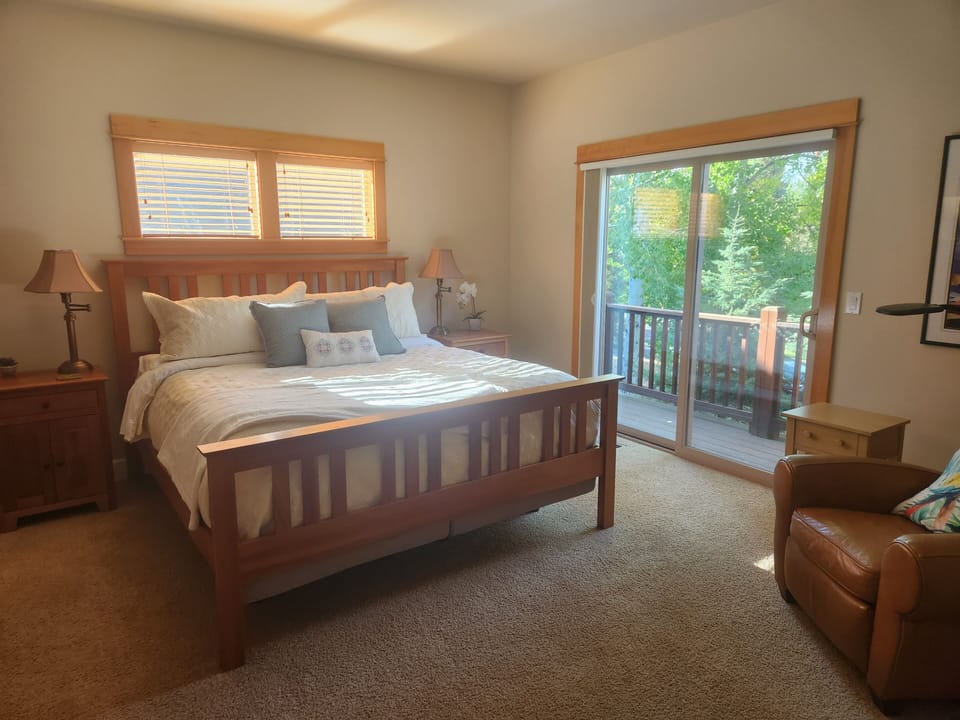 Sliding glass door leads to small outdoor deck. Blackout window shades.