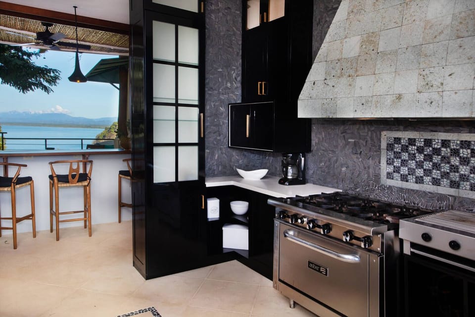The kitchen is fully equipped with appliances fit for a chef.