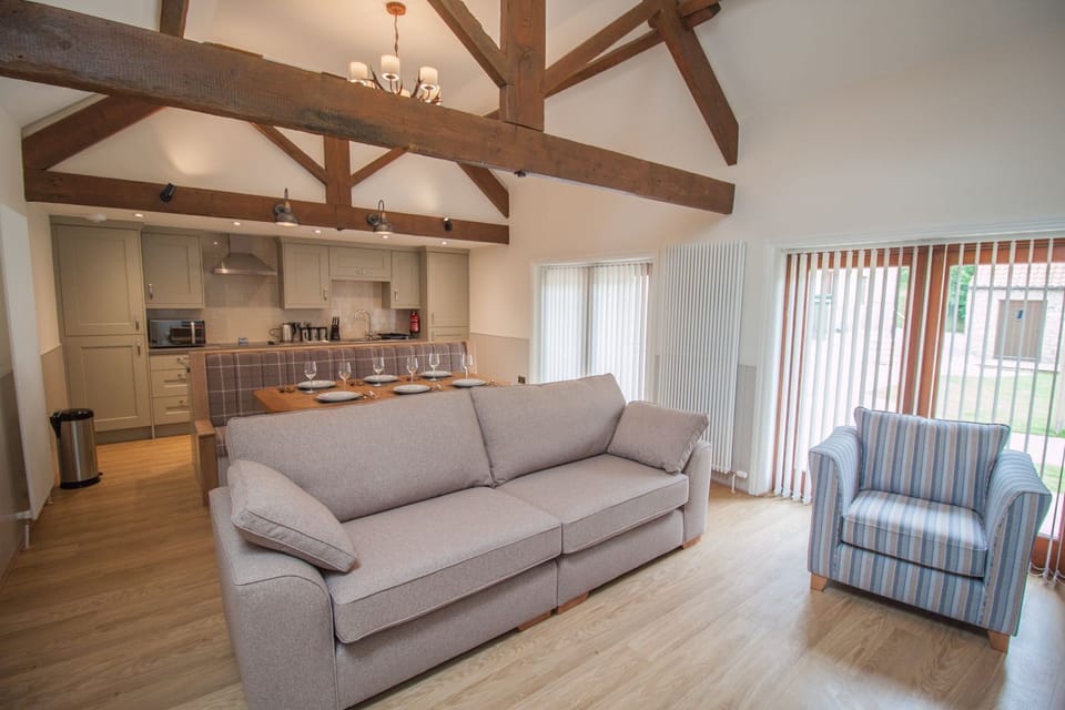 Open plan living with exposed beams