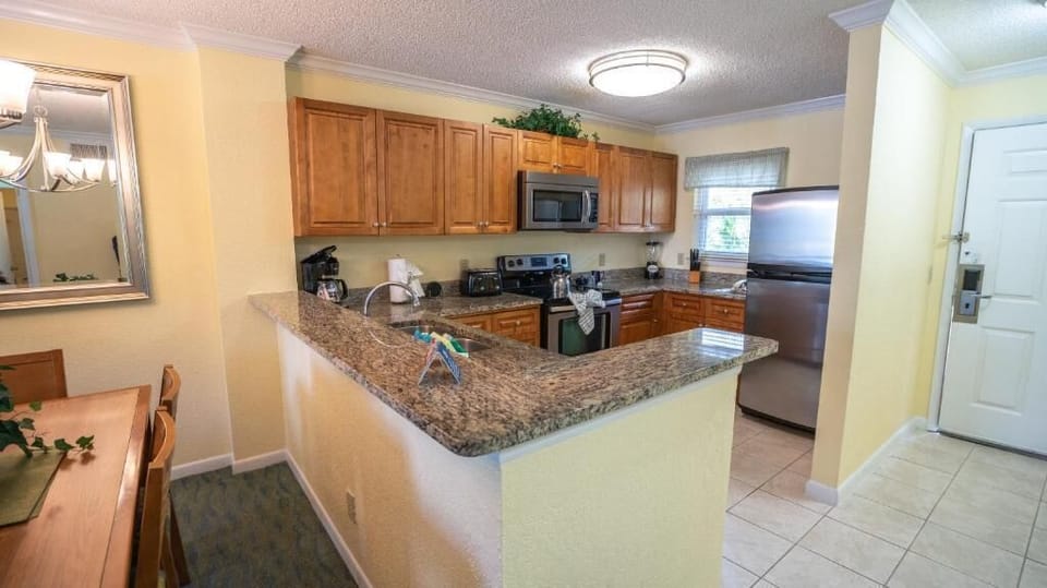 Gather around the granite bar for snacks and easy conversation