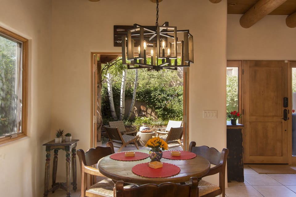 Dining area and doors that open onto patio w/grill