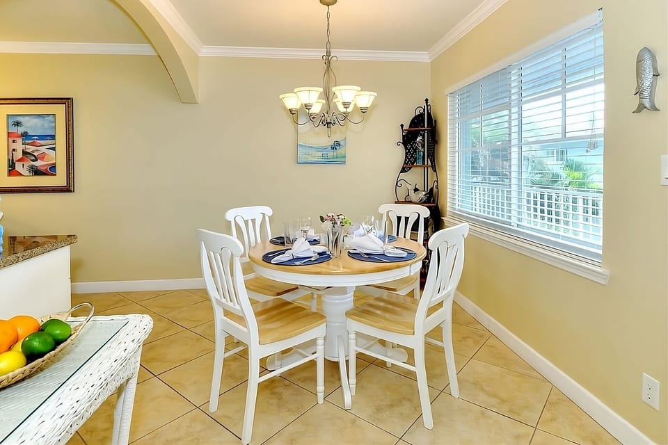 Gather for relaxed meals beneath warm, welcoming lighting.