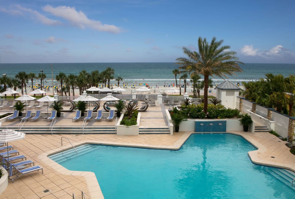 Breathe in ocean breezes from this palm-framed pool deck.