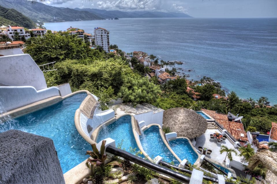 Cascading waterfalls flow from villa to villa