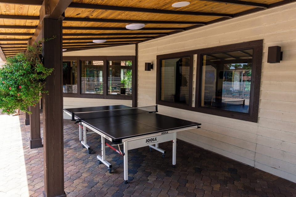 Challenge friends to ping-pong under a shaded, airy pavilion.