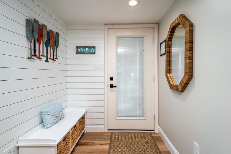 Private entry to this adorable beach villa. Shiplap walls and a great bench to ditch the shoes and let the vacation begin.
