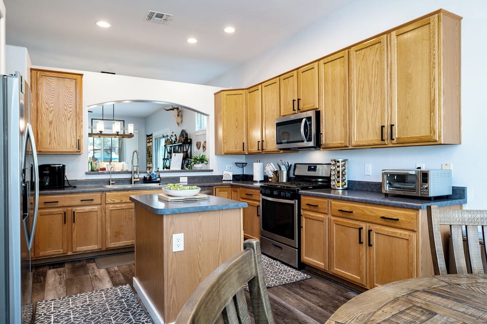 Space to move and tools to cook. Enjoy this spacious, fully equipped kitchen.
