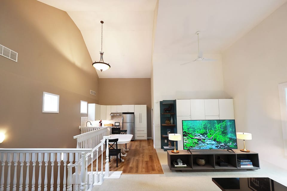 Open concept with cathedral ceilings, yet a well defined and functional space. 