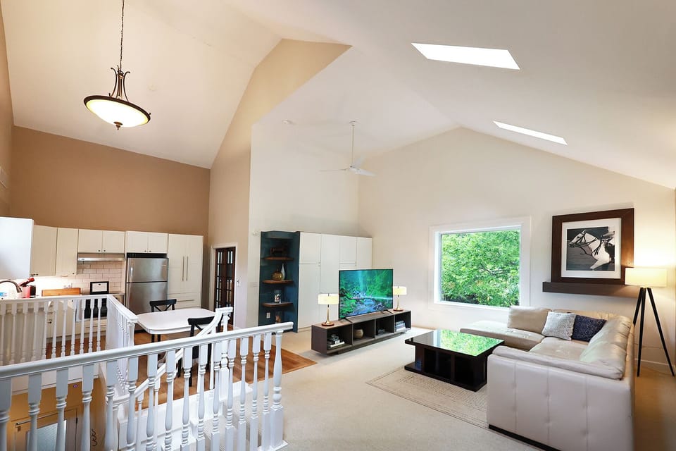 Living room with a view, gorgeous 5 ft. window.  Ever-changing scenery. 
