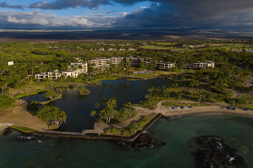 Bird’s-eye view of Mauna Lani Terrace showcasing its stunning oceanfront setting and lush surroundings.