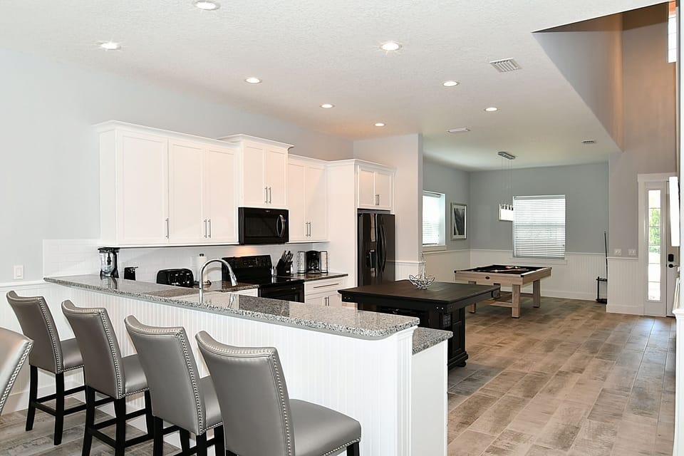 Additional seating at the kitchen counter.