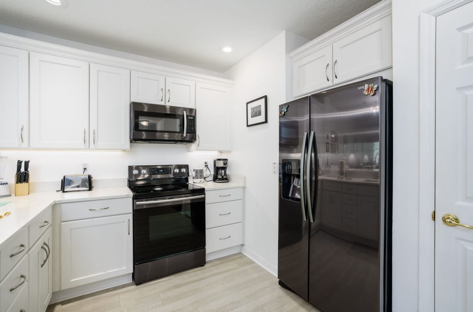 Cook up your favorite meals in this lovely bright kitchen.