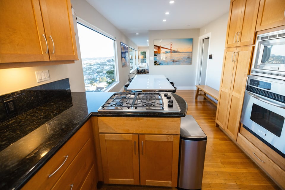 Kitchen with living room in the distance.