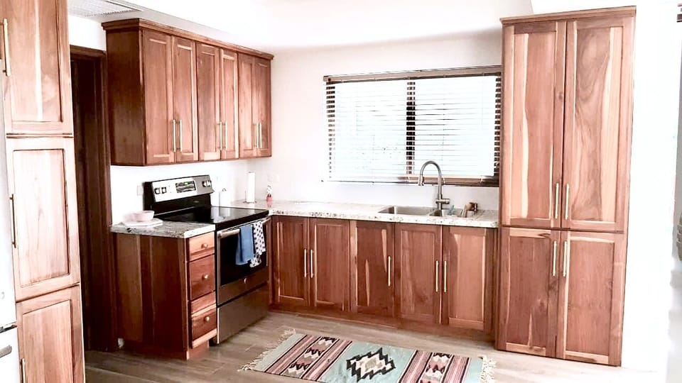 Custom, fully equipped teak kitchen. 