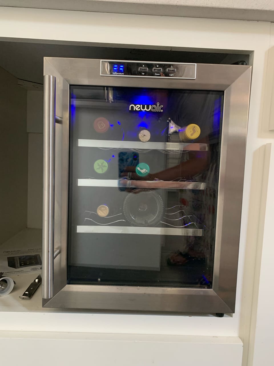 Wine refrigerator in kitchen. 