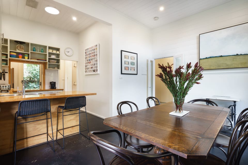 A well-equipped kitchen adjoins spacious dining area flowing into the garden.