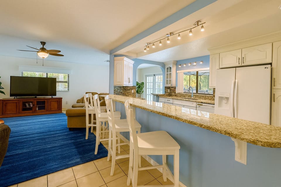 The open kitchen lends to family fun.