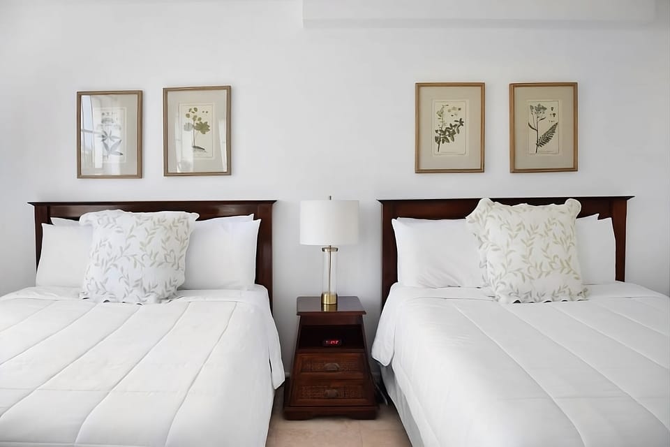 Recharge in spotless, hotel-soft bedding and soothing décor.