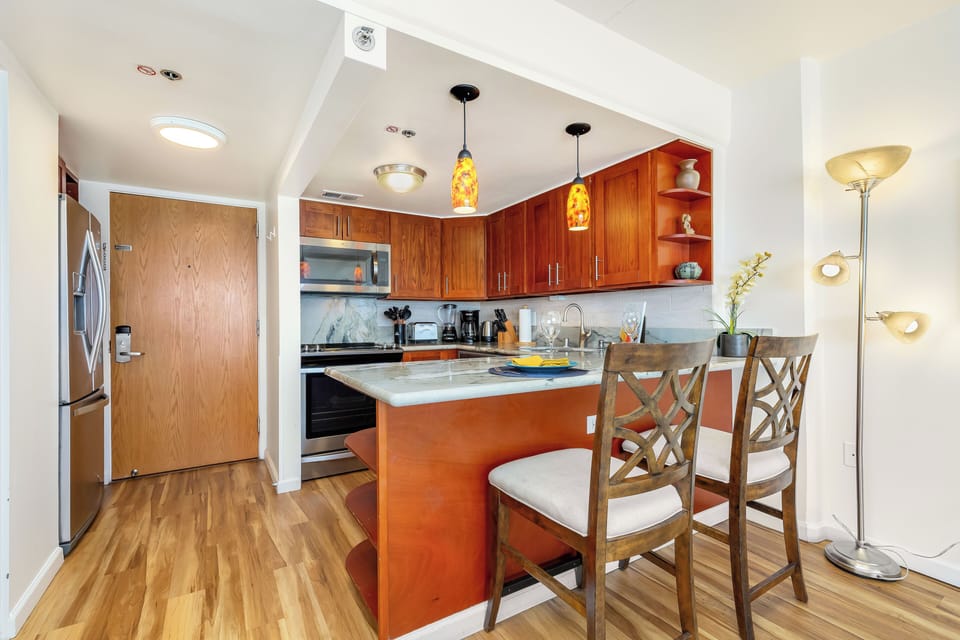 A fully equipped kitchen with a stylish island