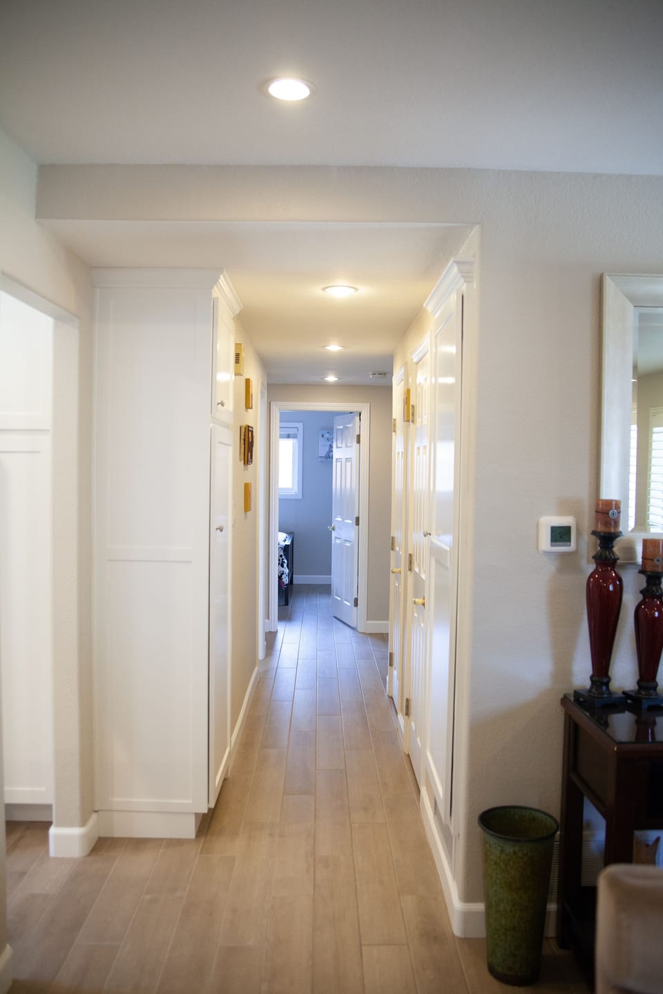 Newly tiled wood looking floors in hall and throughout home.