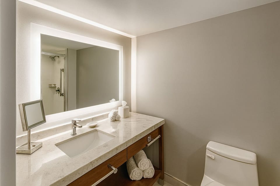 Refresh effortlessly with a bright vanity and spa-clean towels.