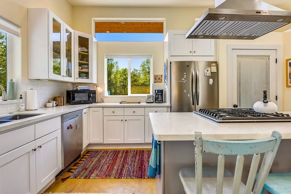 Bright, sunny kitchen with lots of light and everything you need for homemade meals.