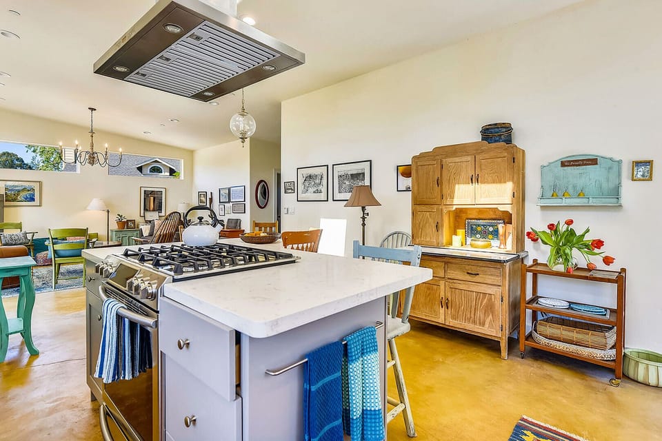 Open design: kitchen, dining and living room - a hint of farmhouse, touches of midcentury modern, so much personality.