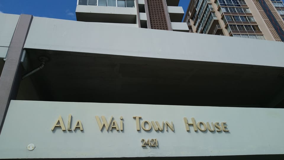 Front entrance. Slow down and smell the plumerias or you will miss it!