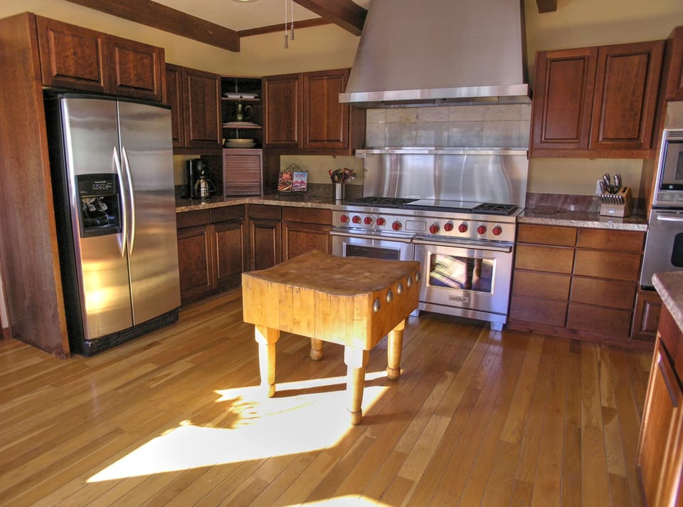 KITCHEN: Spacious room with lots of counter space, 2 refrigerators, 2 dishwashers and a Wolf gas range. Also offers up-close red rock views and  views of the red rock vista to the east named the Mogollon Rim.