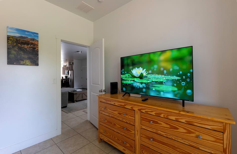Bedroom 4 dresser with 55" Smart TV.