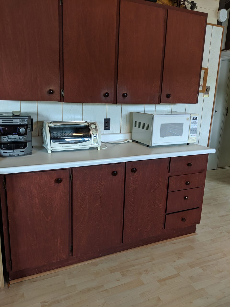 Kitchen has microwave and toaster oven and lots of cupboard space. 