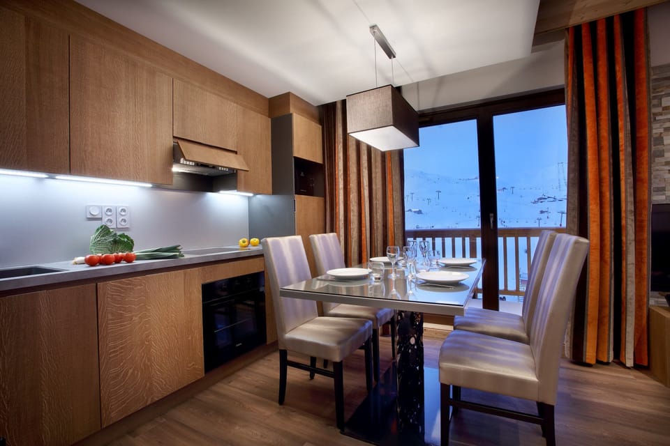 Prepare meals in the kitchenette and enjoy them at the dining table.