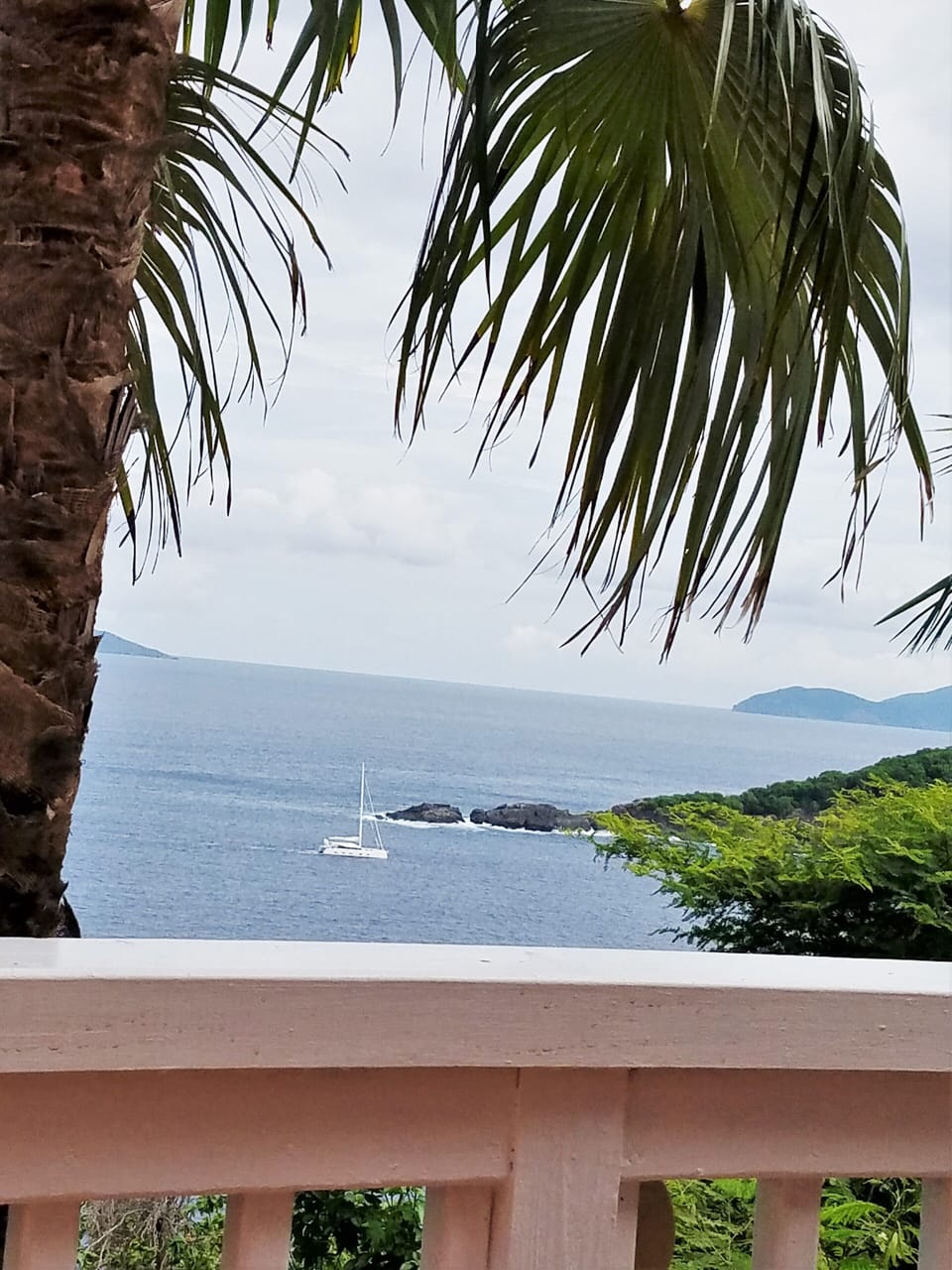 View from deck - sailing past the tip of Thatch Cay, Jost &Tobago in background 
