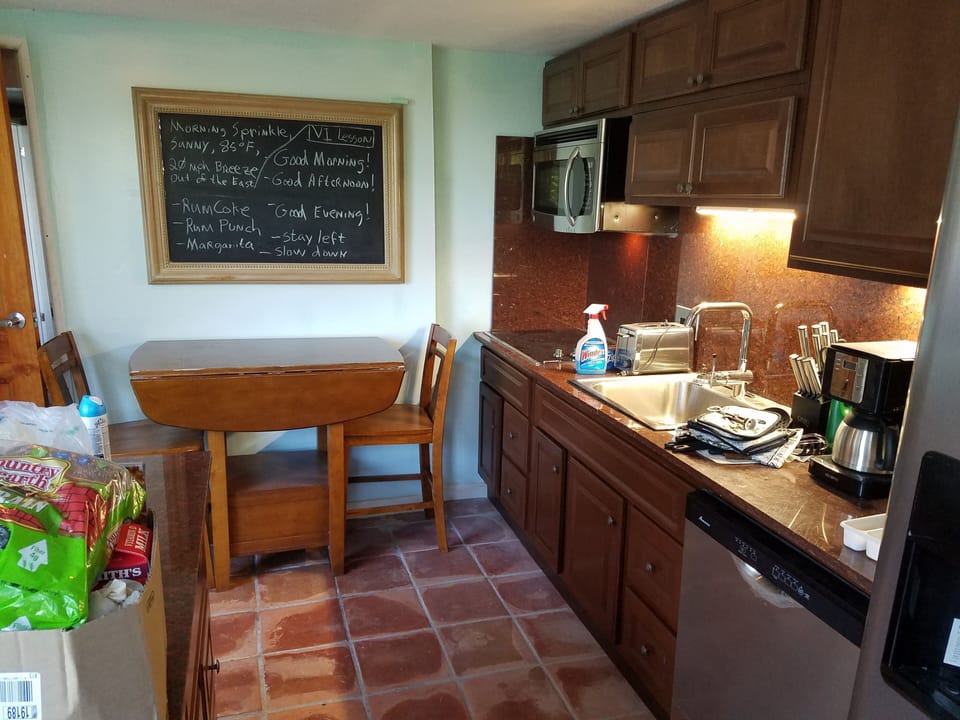 kitchen-granite counters/backsplash, island, microwave, cooktop, d/w, refrig.