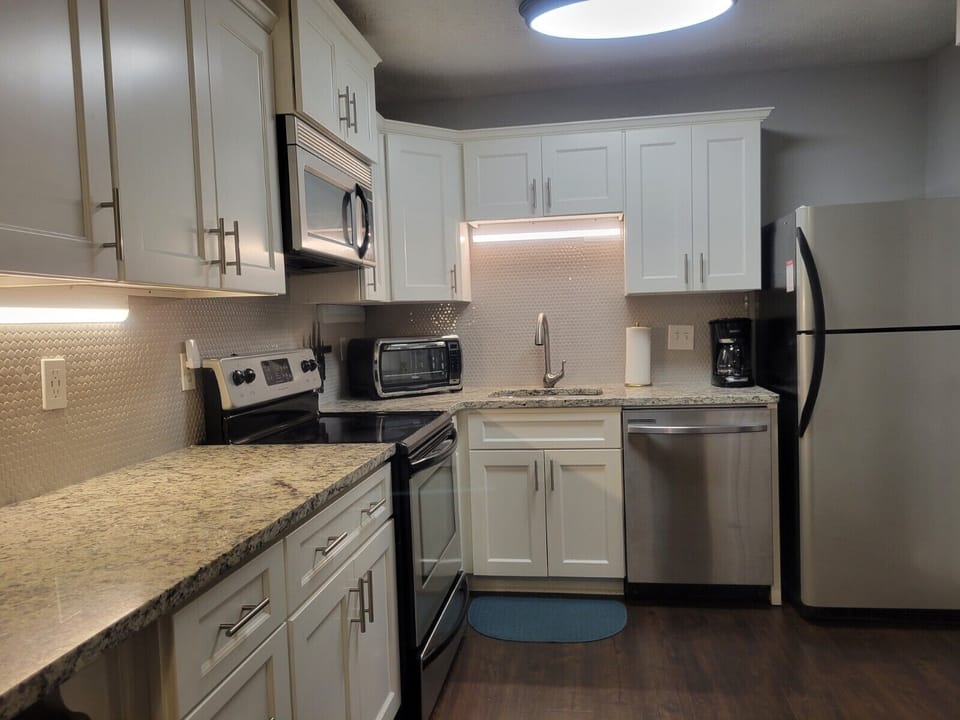Modern appliances, new granite countertops and tile backsplash