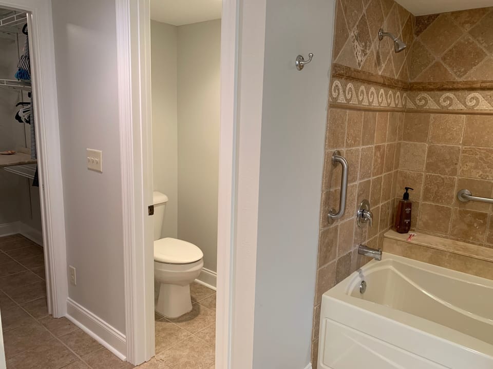 Master bath with large tub/shower, private toilet, walk-in closet, laundry room