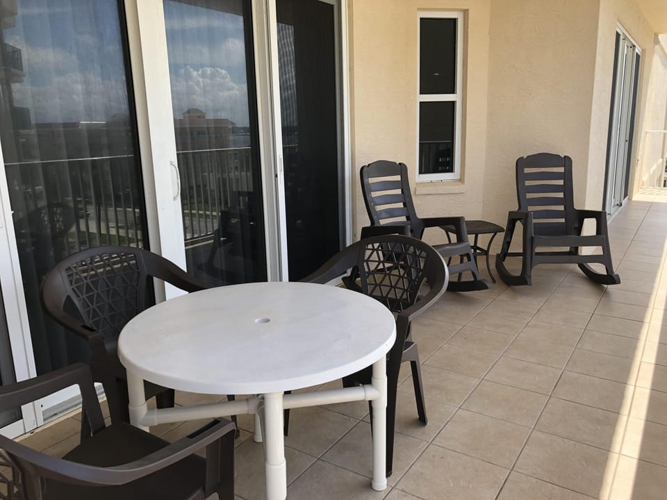 Private balcony seating off master bedroom.
