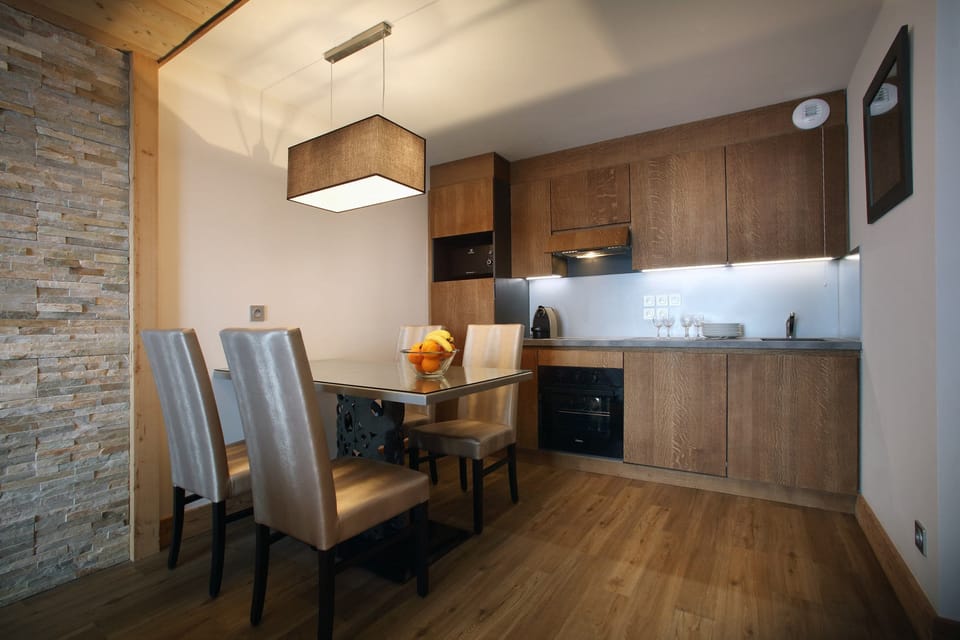 Prepare meals in the kitchenette and enjoy them at the dining table.