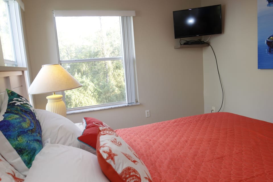 Guest bedroom with 32 inch television