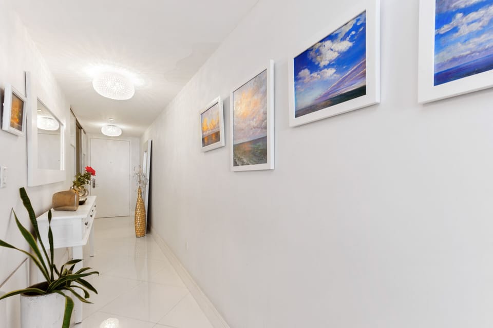 Entrance hallway, looking towards entry door.  Original art.