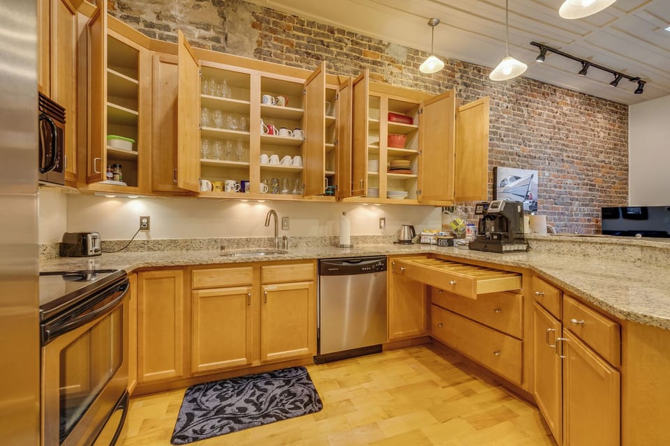 The kitchen has all of the essentials - pots and pans, dishes, glassware, utensils, spices, etc. You'll have everything you need to cook your own meal if you choose.  Remember too that you are right in the middle of plenty of great restaurants!
