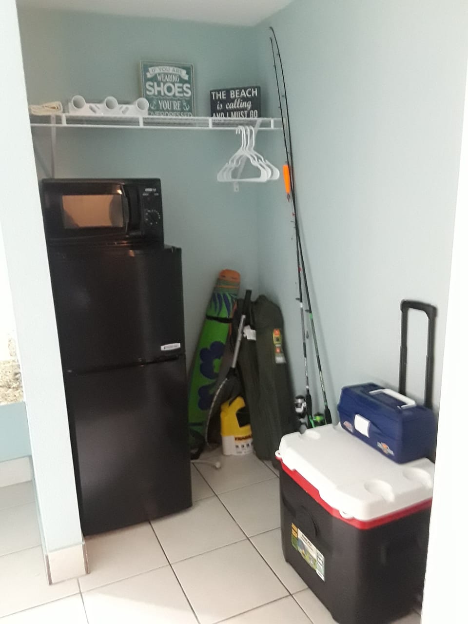 small fridge/freezer, microwave, beach chairs, fishing rods, tackle box
