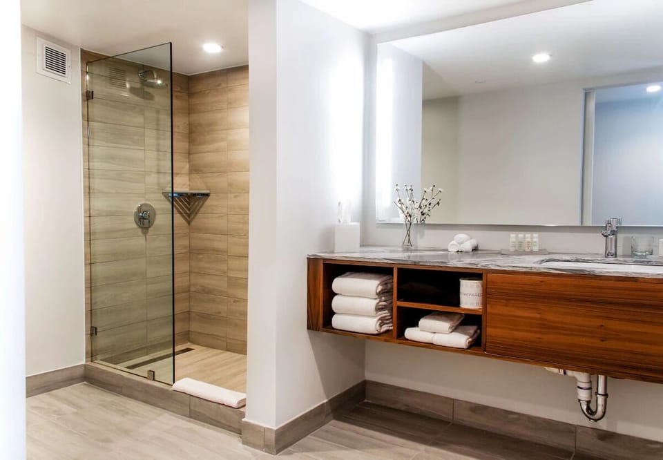 Step into a spacious walk-in shower for an easy reset.