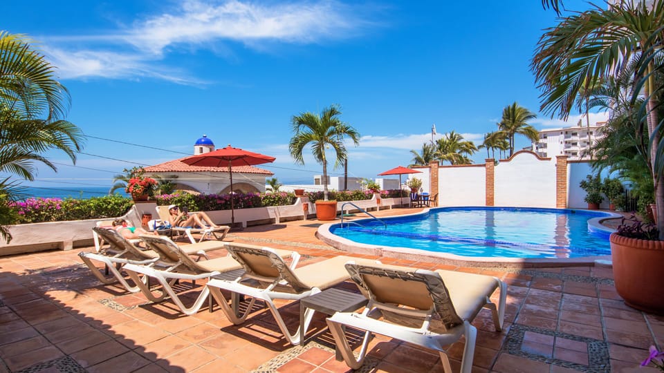 Pool area with view of ocean