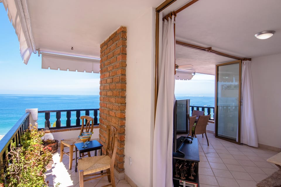wrap around balcony with sliders that open entire wall on both sides