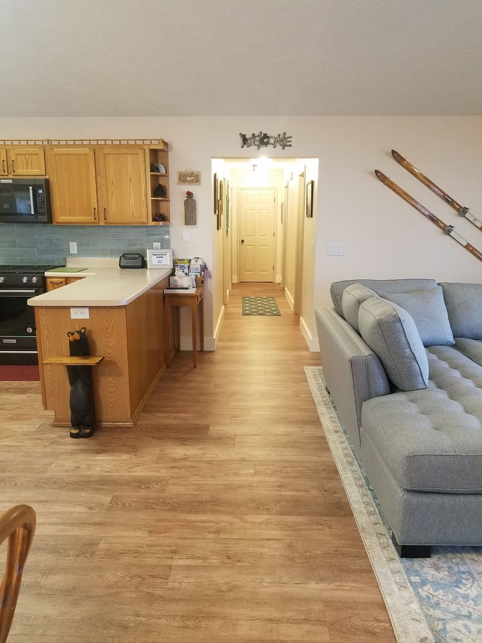 Living area looking toward hallway that leads to laundry, bedrooms and bathrooms